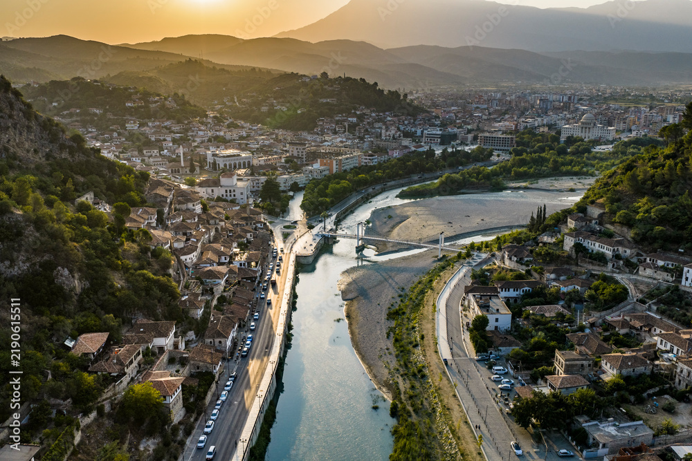 Naklejka premium Oblique Aerial View of a Historic River City in a Mountain Valley in Berat, Albania