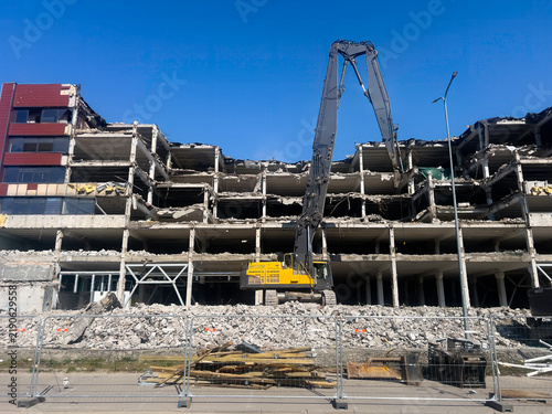 Crane is demolishing an old concrete building. Riga Latvia