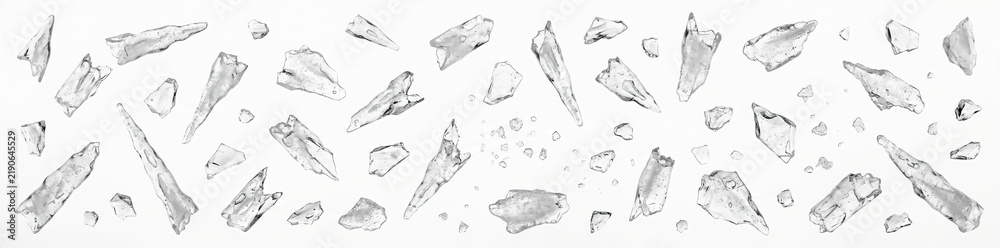 Obraz premium The scene shows various pieces of ice arranged on a clean white background. These pieces can be used for Christmas decorations or themed projects during the holiday season