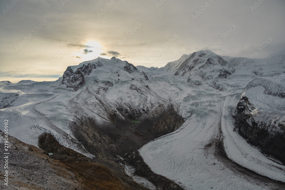 Obraz premium Gornergrat Zermatt Switzerland, sunrise at Monte Rosa peak and Alps mountain range in winter