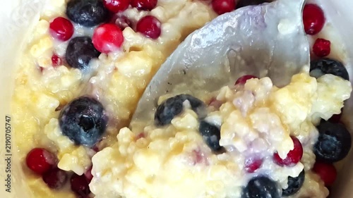 Oatmeal with Blueberries and Cranberries, Healthy Breakfast with Berries Close Up