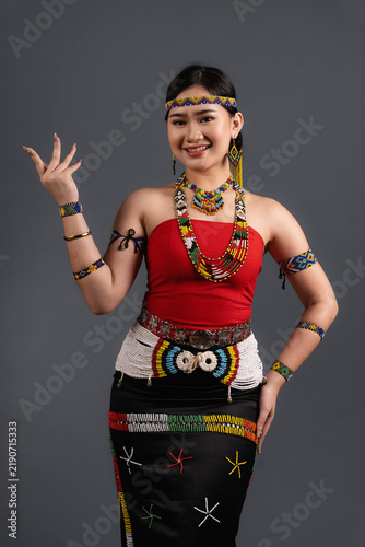 Canvastavla Smiling Sabahan Woman in Traditional Murut Tahol Simba Attire Posing with Raised