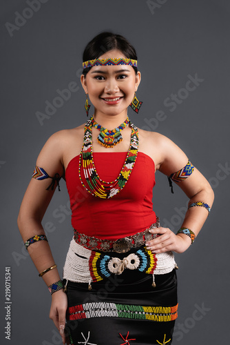 Canvastavla Young Sabahan Woman Wearing Traditional Murut Tahol Simba Costume Posing with Ha