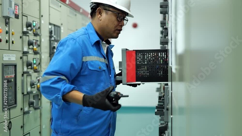 Professional electrical maintenance of a motor feeder starter module, testing control functions and protection systems to ensure dependable industrial operation.