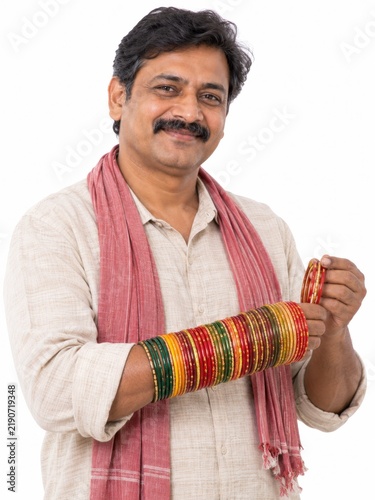 Indian Man Holding Colorful Bangles for Women