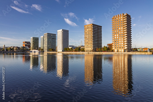 Принти на полотні Antwerp, Belgium: Beautiful water reflection of the modern residential apartment towers in the Eilandje district of Antwerp, a trendy redeveloped port area with contemporary architecture