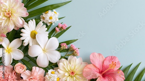 Elegant tropical and garden flowers with lush green palm leaves creating a colorful floral border on a soft blue background with copy space