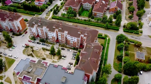Aerial view of a residential neighborhood with apartment buildings and parking lots in a suburban area