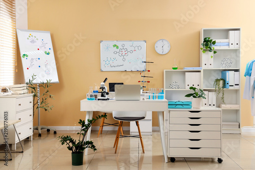 Scientific research and pharmaceutical development, laboratory workspace with...
