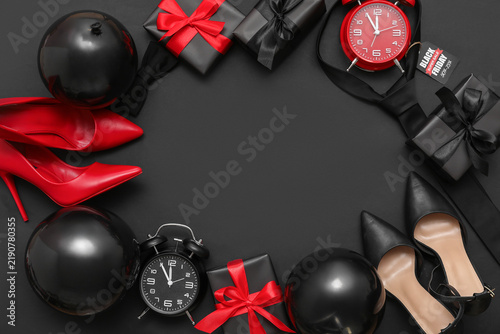 Frame made of gifts, balloons, male accessories and female shoes on dark back...