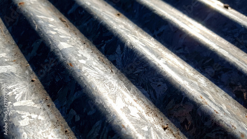 Obraz na płótnie Corrugated steel texture under sunlight