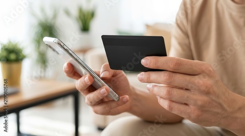 A person using a smartphone and credit card for a digital shopping finance installment service.