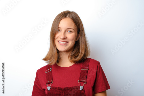 Quadro su tela beautiful young woman with metallic dental braces smiling confidently portrait p