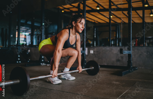 Konstfotografi Strength training functional fitness setup allows determined Hispanic female ath