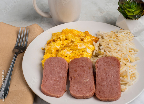 Fotografie scramble eggs  with    pan sheared spam and hash browns