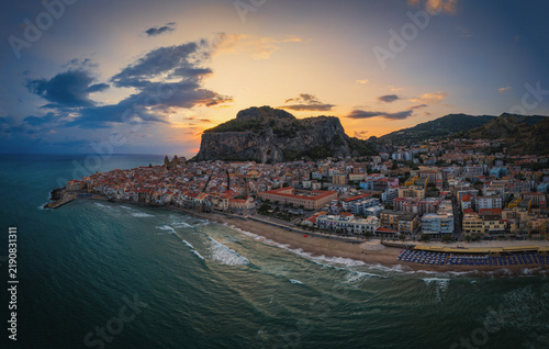 Sunrise at Cefalu Sicily, old town of Cefalu Sicilia panoramic view at the colorful village. Aerial drone shot, August 2024