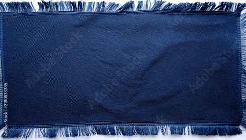 piece of dark blue fabric with frayed edge
