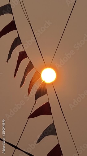 Sun with cables and pennants

