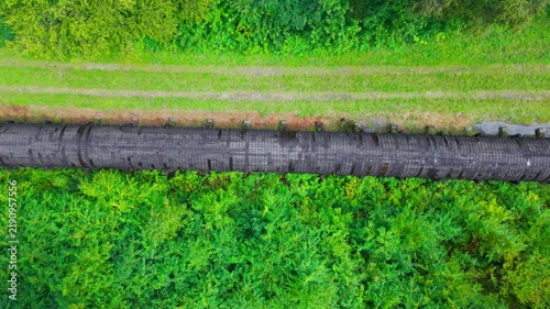 Summer aerial view featuring the 3.4 mile long wooden penstock in Vermont known as The Snake that runs from the Searsburg Dam to a generating station along the Deerfield River with an 8 foot diameter