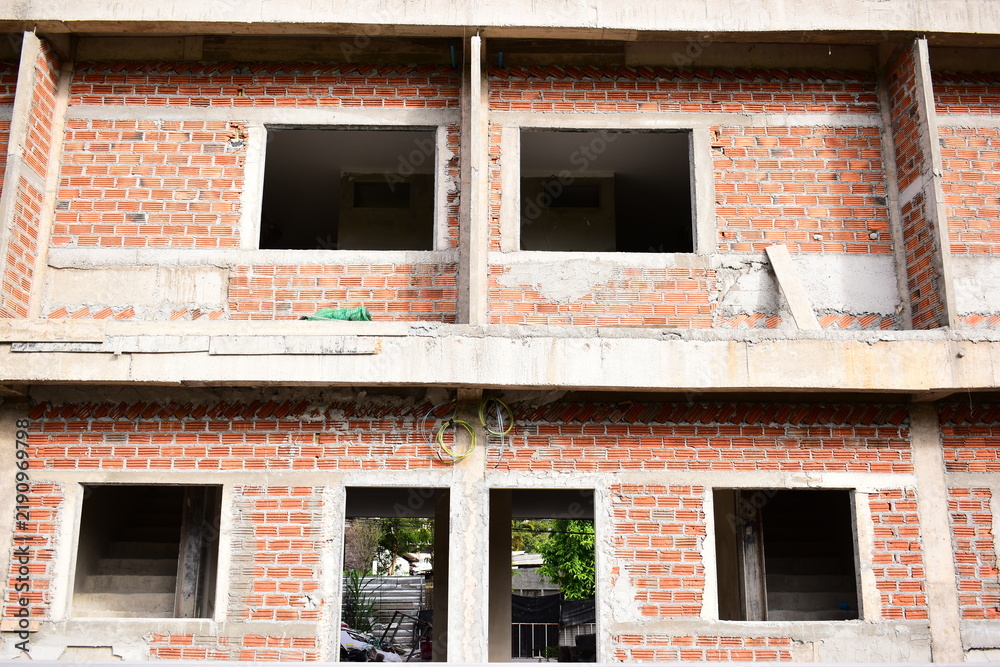 Obraz premium exterior view of brick house under construction with concrete structure