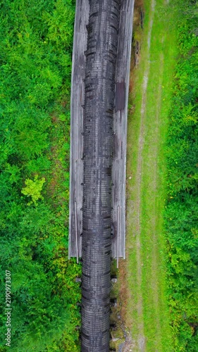 Summer aerial view featuring the 3.4 mile long wooden penstock in Vermont known as The Snake that runs from the Searsburg Dam to a generating station along the Deerfield River with an 8 foot diameter