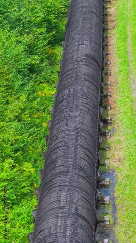 Summer aerial view featuring the 3.4 mile long wooden penstock in Vermont known as The Snake that runs from the Searsburg Dam to a generating station along the Deerfield River with an 8 foot diameter