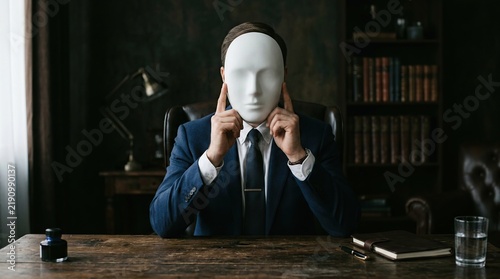 Man in Suit Wearing White Mask Hiding Identity in Office