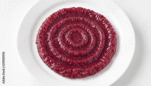 Quadro su tela A circular, spiral-patterned layer of thick, dark red berry jam spread evenly on