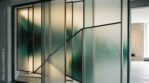 Frosted glass wall with black metal frames