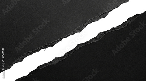 Torn Black Paper Revealing White Background.