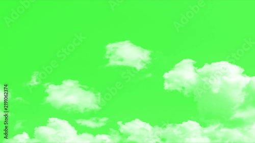 Moving clouds motion graphic effects on green screen background. White fluffy clouds on a green screen. perfect for video editing and motion graphics. White Clouds Spreads footage.