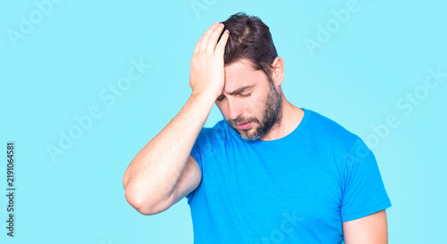 Canvas Print Thoughtful man touching forehead with palm