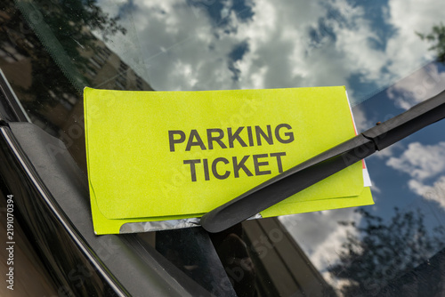 Richmond, Virginia, USA A parking ticket on the windshíeld of a car.