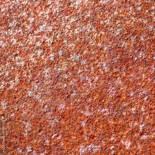Принти на полотні Close-up of rust and corrosion covering a metal sheet, creating a rough orange brown texture and industrial background showing oxidation, weathering and material deterioration