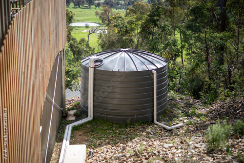 Rural Water Storage Tank Amidst Lush Greenery