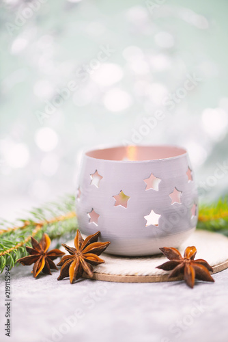 Quadro su tela Candle holder, tealight with stars and a burning candle light, winter christmas