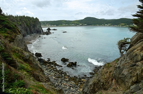 looking out across big chance cove, to rocky  chance cove beach and turquoise-colored water from the cliffs while hiking the chance cove coastal trail  on the isthmus of  avalon peninsula  in newfound