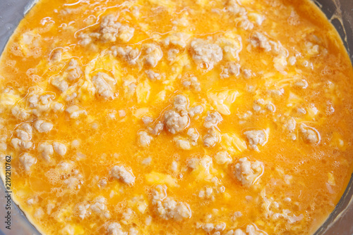 Fresh and appetizing Thai-style omelet cooking in a frying pan.