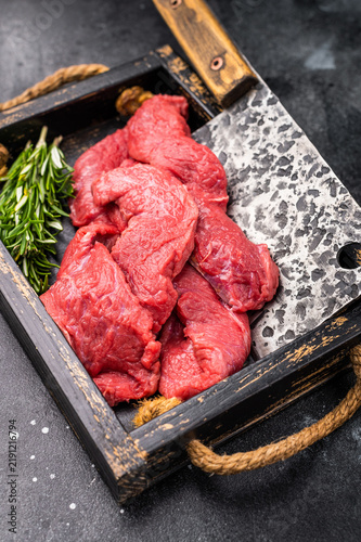 Quadro su tela Vibrant raw bison meat pieces on a butcher block, illustrating the allure of this lean protein source for health-conscious culinary enthusiasts