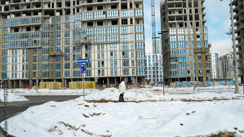 Принти на полотні A bustling construction site set against the backdrop of winter showcases several new buildings currently under development