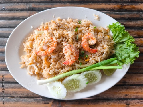 Konstfotografi Thai Shrimp Fried Rice With Cucumber and Lime on Bamboo Table for Culinary Conce