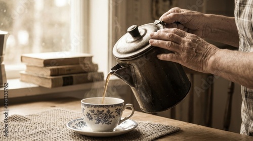 Hands Pouring Hot Coffee from Antique Metal Kettle into Porcelain Cup
