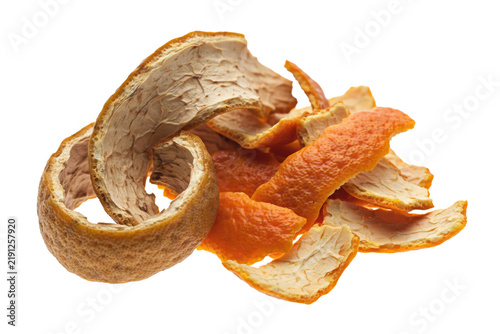Dried orange peels arranged in a pile with textured rind surfaces and white pithy undersides isolated on a transparent background