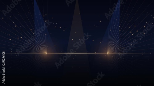 Elegant gold and blue stage spotlights with glowing particles and laser lines on dark background