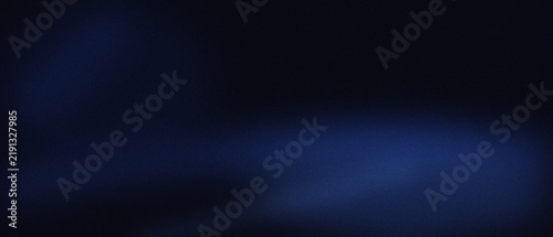 Abstract dark blue background with soft light gradients with subtle grainy texture