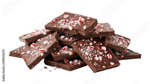 Pile of dark chocolate bark with crushed peppermint candy isolated on transparent background
