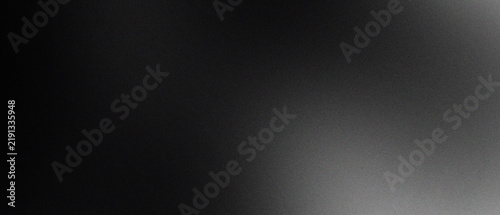 Abstract dark background with subtle film grain texture with light gradient fading