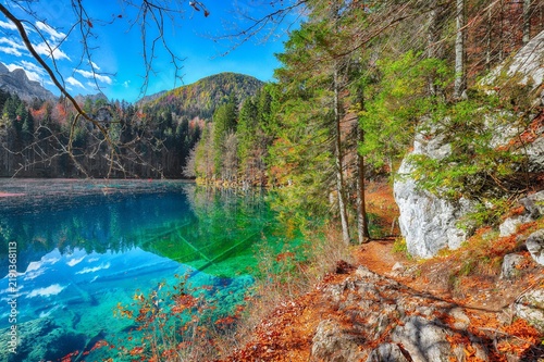 Stunning view of Fusine lake with Mangart peak on background.