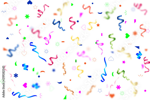 Colorful party streamers and confetti isolated on white background