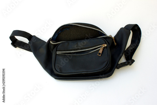 Black leather fanny pack with adjustable strap isolated on white background